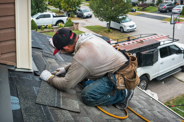 Professional Roofing technician working in Alto, MI